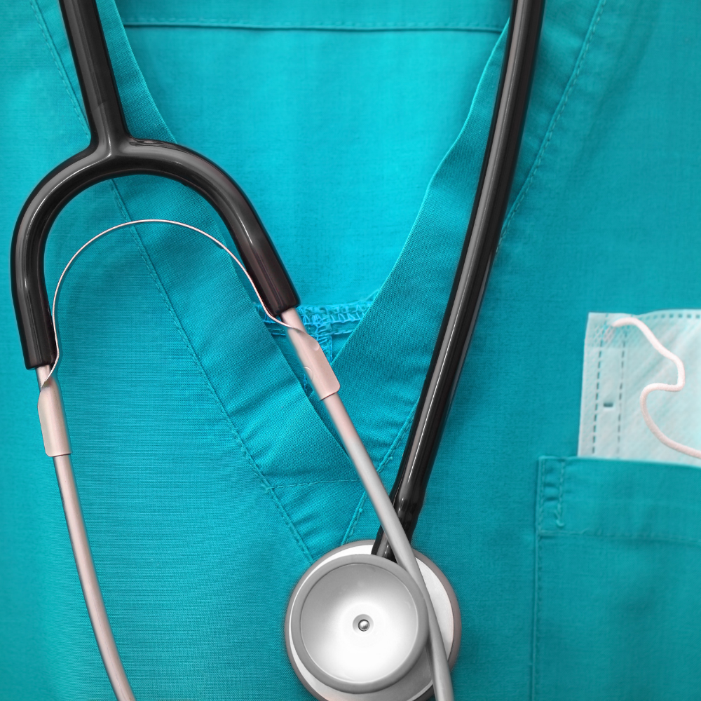 Close-up of a stethoscope placed on green medical scrubs in Ventura County California. Modern Medical Uniform Fabrics technology in scrubs